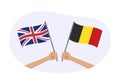 UK and Belgium flags. Belgian and British national symbols. Hand holding waving flag. Vector illustration Royalty Free Stock Photo